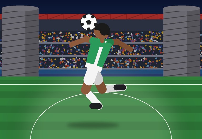 A player heads the ball at night