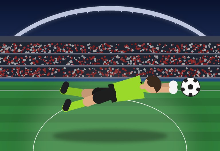 A goalkeeper dives at night